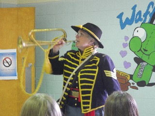 Sgt Miller demonstrates bugle calls